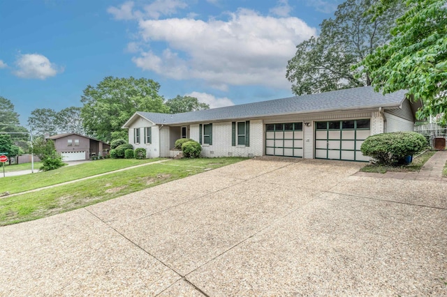 4204 Fox Hill Rd, North Little Rock, AR 72116 - ranch-style home featuring brick siding, a garage, driveway, and a front lawn