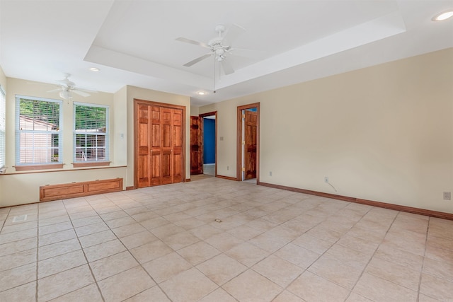 4204 Fox Hill Rd, North Little Rock, AR 72116 - unfurnished room featuring a tray ceiling, a ceiling fan, recessed lighting, baseboards, and light tile patterned floors