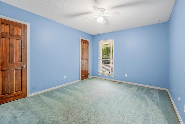 4204 Fox Hill Rd, North Little Rock, AR 72116 - unfurnished bedroom with carpet flooring, baseboards, a ceiling fan, and a textured ceiling