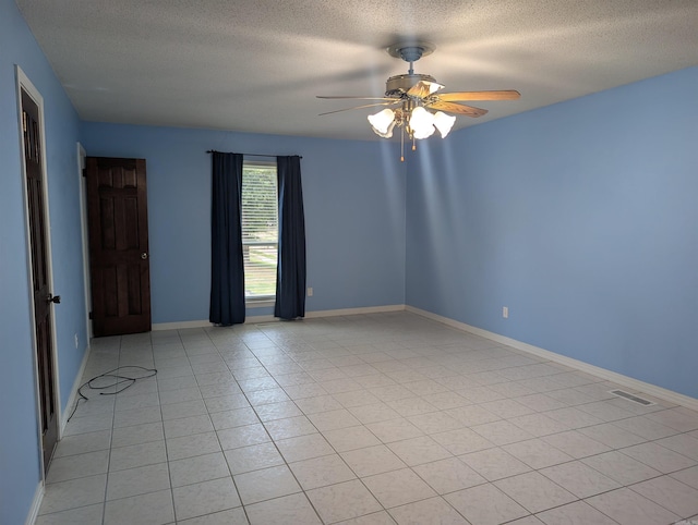 4204 Fox Hill Rd, North Little Rock, AR 72116 - empty room with a textured ceiling, a ceiling fan, baseboards, and light tile patterned floors