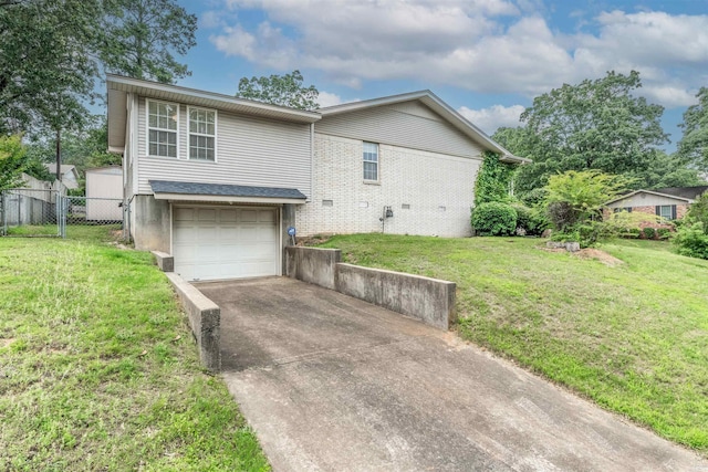 4204 Fox Hill Rd, North Little Rock, AR 72116 - view of front of house featuring a garage, driveway, and brick siding