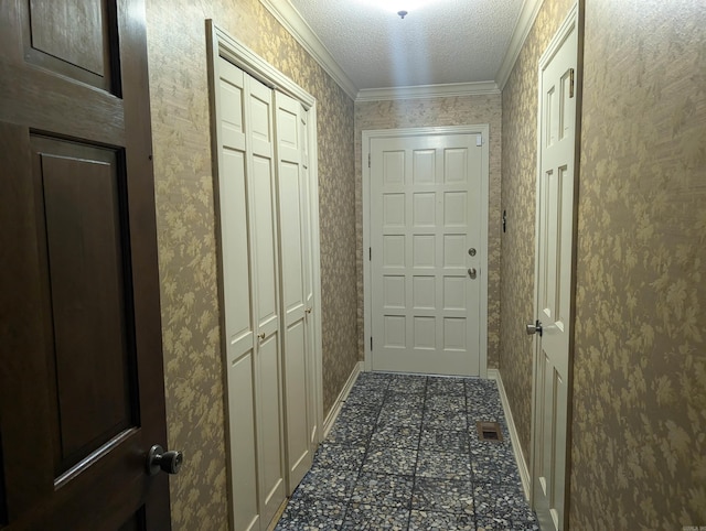 4204 Fox Hill Rd, North Little Rock, AR 72116 - doorway with crown molding, a textured ceiling, and baseboards