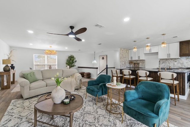 7 Buttermilk Rd, Little Rock, AR 72227 - living room featuring light wood-style flooring, a ceiling fan, recessed lighting, and baseboards