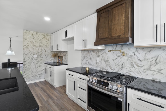 7 Buttermilk Rd, Little Rock, AR 72227 - kitchen featuring stainless steel gas range oven, dark stone countertops, and white cabinetry