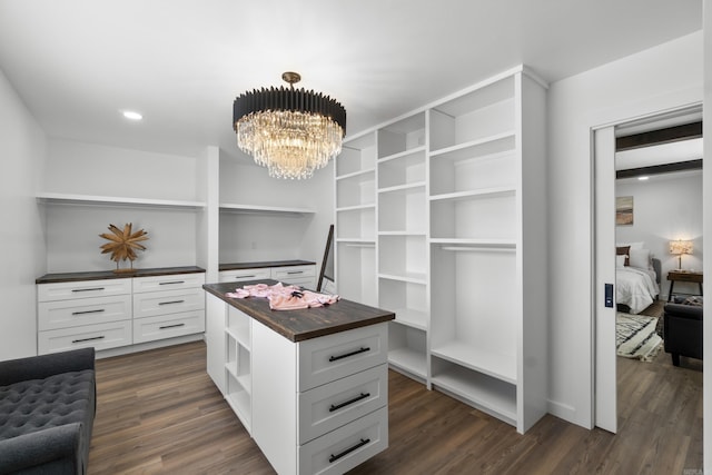 7 Buttermilk Rd, Little Rock, AR 72227 - walk in closet featuring dark wood finished floors and a chandelier