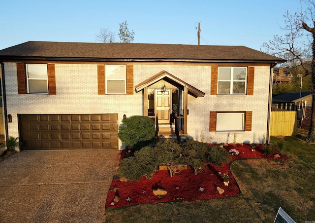 7 Buttermilk Rd, Little Rock, AR 72227 - bi-level home featuring brick siding, driveway, and an attached garage
