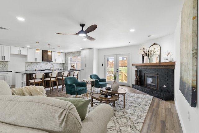 7 Buttermilk Rd, Little Rock, AR 72227 - living room featuring ceiling fan, french doors, recessed lighting, wood finished floors, and baseboards