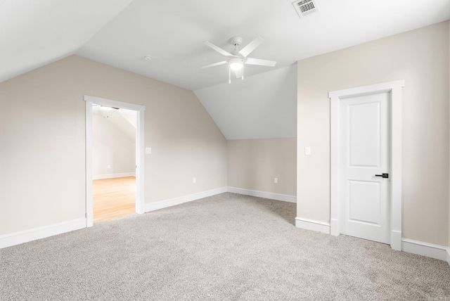 bonus room featuring carpet, ceiling fan, lofted ceiling, and baseboards