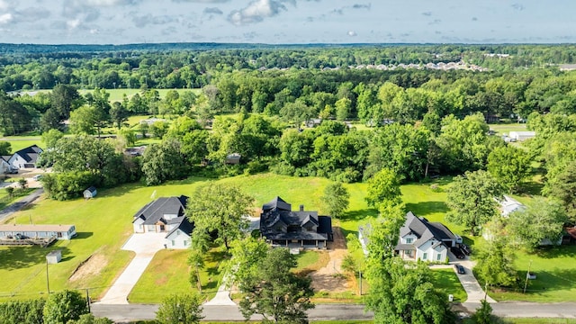 aerial perspective of suburban area with a heavily wooded area