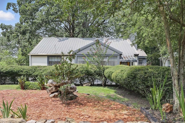 1810 S Pierce St, Little Rock, AR 72204 - view of front facade featuring metal roof and a chimney