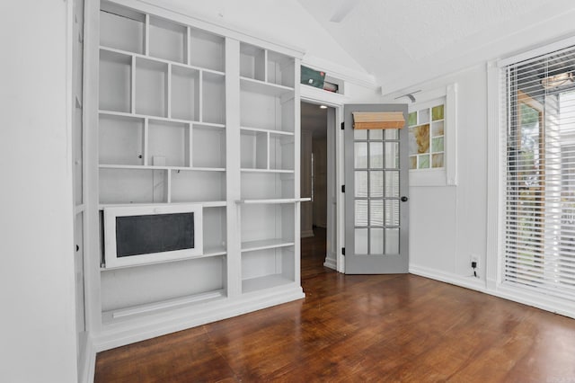 1810 S Pierce St, Little Rock, AR 72204 - unfurnished room with vaulted ceiling, wood finished floors, and a textured ceiling