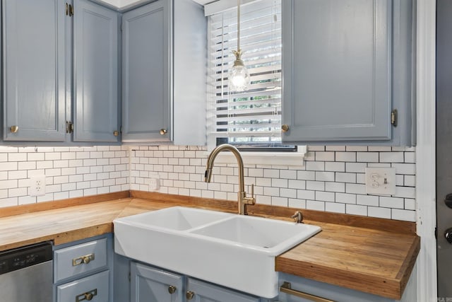 1810 S Pierce St, Little Rock, AR 72204 - kitchen featuring wooden counters, a sink, stainless steel dishwasher, and tasteful backsplash