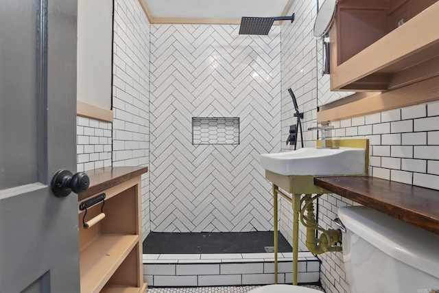 1810 S Pierce St, Little Rock, AR 72204 - full bath with toilet, tiled shower, tile walls, decorative backsplash, and pet washing area