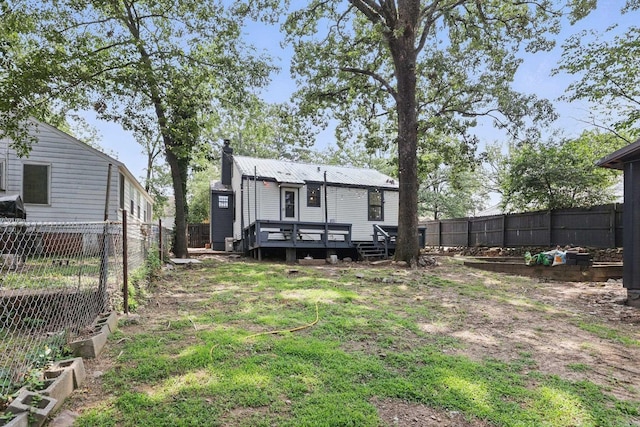 1810 S Pierce St, Little Rock, AR 72204 - back of property featuring a deck and a fenced backyard