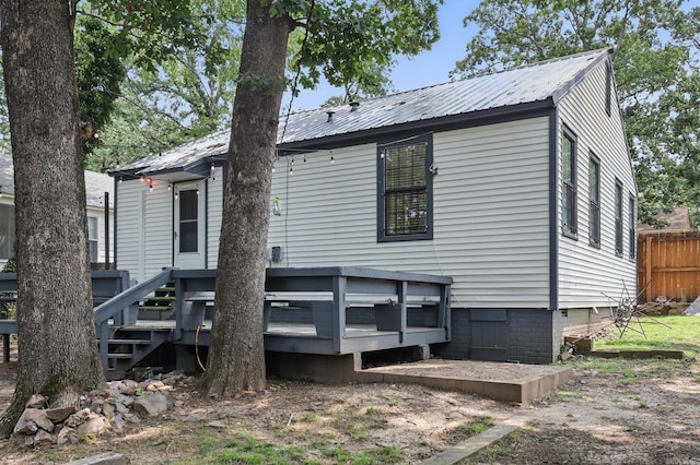 1810 S Pierce St, Little Rock, AR 72204 - rear view of property with metal roof and a wooden deck