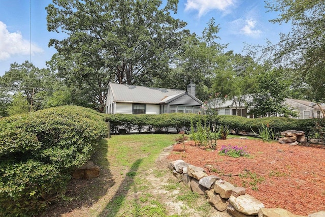 1810 S Pierce St, Little Rock, AR 72204 - view of front of home featuring a front yard and a chimney