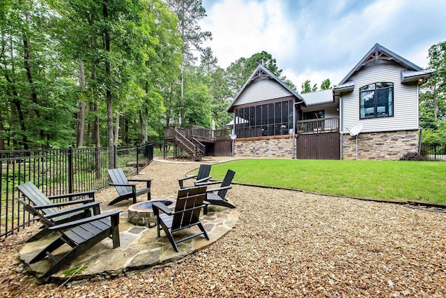 43 Mikes Cir, Heber Springs, AR 72543 - view of yard with an outdoor fire pit, stairway, a patio area, a deck, and a sunroom
