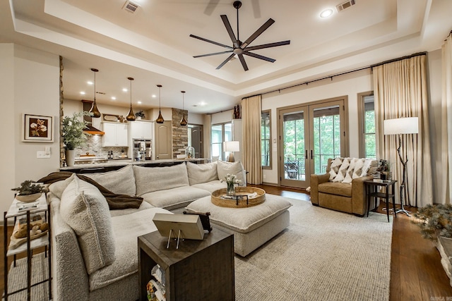 43 Mikes Cir, Heber Springs, AR 72543 - living area with a raised ceiling, french doors, light wood-style flooring, ceiling fan, and recessed lighting