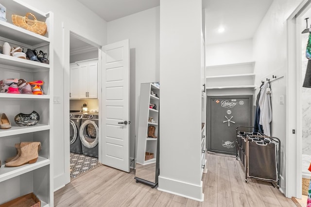 67 Falstone Dr, Little Rock, AR 72223 - laundry room with cabinet space, washer and clothes dryer, and light wood finished floors