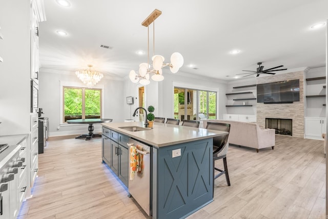 67 Falstone Dr, Little Rock, AR 72223 - kitchen with a sink, stainless steel dishwasher, a breakfast bar, white cabinetry, and ceiling fan