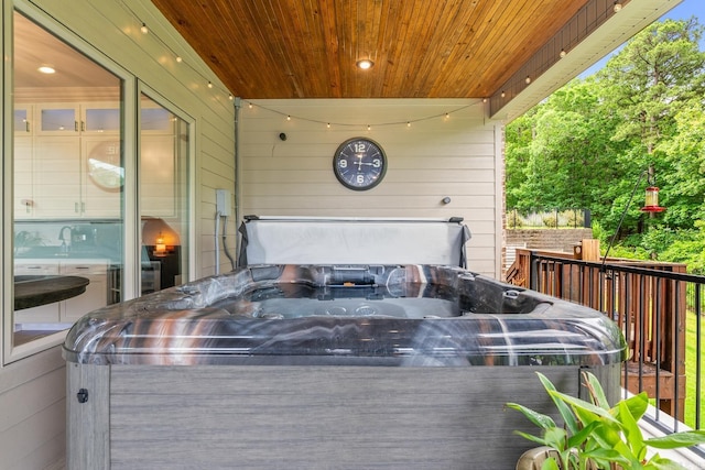 67 Falstone Dr, Little Rock, AR 72223 - view of patio with a hot tub and a deck