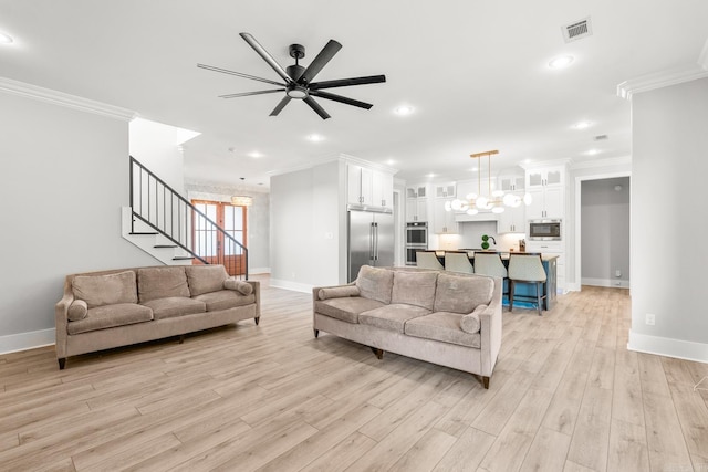 67 Falstone Dr, Little Rock, AR 72223 - living room featuring ornamental molding, baseboards, a ceiling fan, light wood-style floors, and stairway
