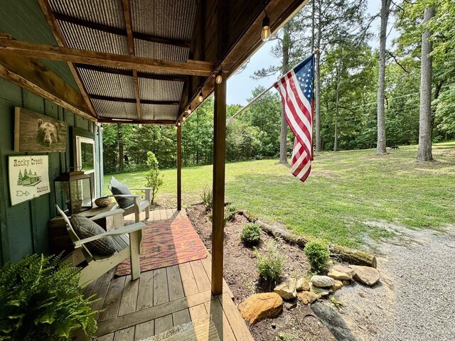 2645 Jumbo Rd, Melbourne, AR 72556 - view of green lawn with a deck