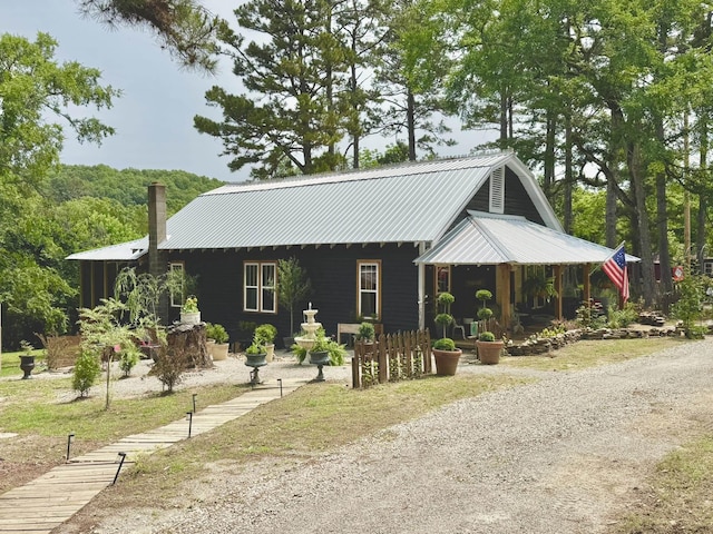 2645 Jumbo Rd, Melbourne, AR 72556 - view of front of home featuring a chimney and metal roof