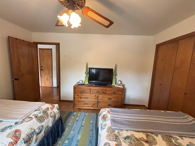 36C Peninsula Dr Unit C, Mount Ida, AR 71957 - bedroom with wood finished floors, a ceiling fan, and a closet