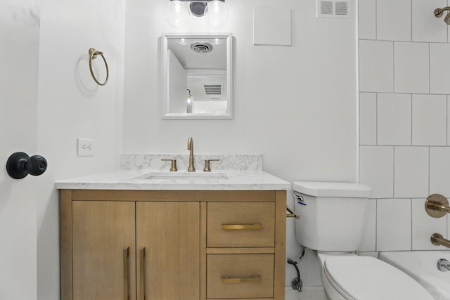 700 E 9th J St, Little Rock, AR 72202 - full bathroom featuring vanity, toilet, and shower / bathtub combination