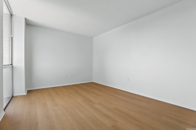 700 E 9th J St, Little Rock, AR 72202 - empty room with light wood-style floors and baseboards