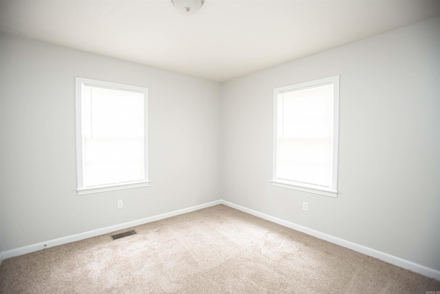 3316 Zion St, Little Rock, AR 72204 - carpeted empty room featuring plenty of natural light and baseboards