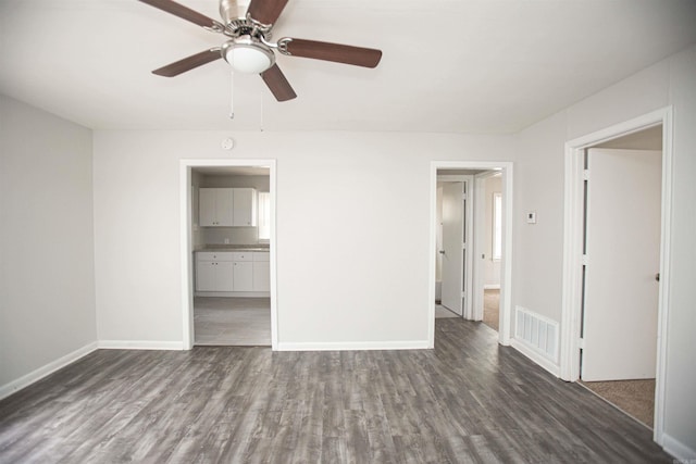 3316 Zion St, Little Rock, AR 72204 - unfurnished living room featuring a ceiling fan, wood finished floors, and baseboards