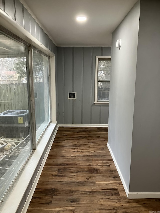 5006 Manor Ave, Little Rock, AR 72204 - corridor featuring dark wood-style floors, baseboards, and plenty of natural light
