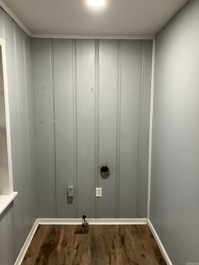 5006 Manor Ave, Little Rock, AR 72204 - laundry room with dark wood-style flooring, a decorative wall, and baseboards
