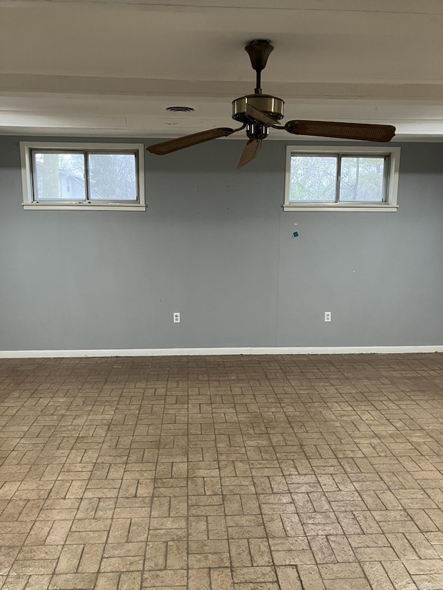 5006 Manor Ave, Little Rock, AR 72204 - empty room featuring ceiling fan and brick patterned flooring