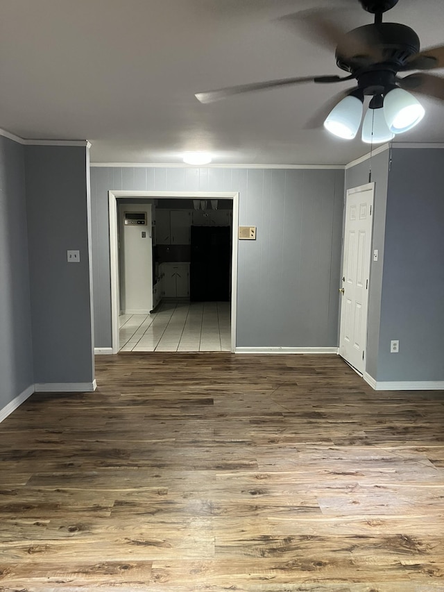 5006 Manor Ave, Little Rock, AR 72204 - unfurnished room with crown molding, wood finished floors, a ceiling fan, and baseboards