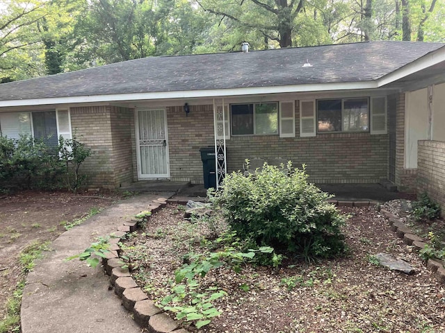 5006 Manor Ave, Little Rock, AR 72204 - ranch-style home with brick siding and roof with shingles