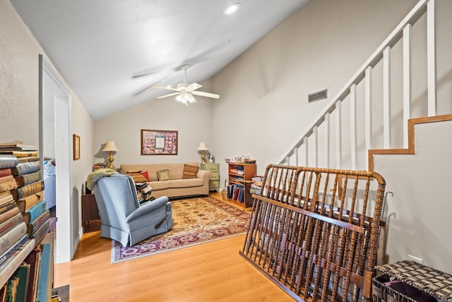 206 Brown, Hot Springs, AR 71913 - living room featuring light wood-style flooring, ceiling fan, lofted ceiling, and stairway