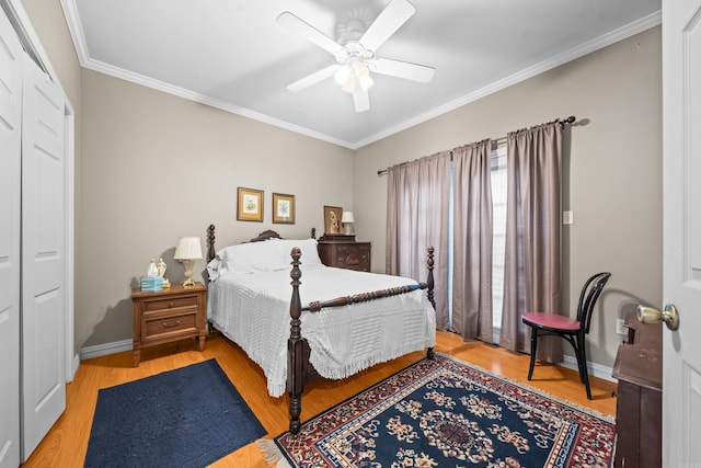 206 Brown, Hot Springs, AR 71913 - bedroom featuring crown molding, wood finished floors, baseboards, a ceiling fan, and a closet