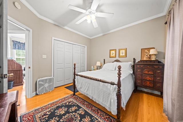206 Brown, Hot Springs, AR 71913 - bedroom featuring wood finished floors, ornamental molding, a closet, and a ceiling fan