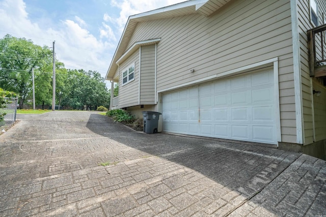 206 Brown, Hot Springs, AR 71913 - view of side of home featuring decorative driveway and an attached garage