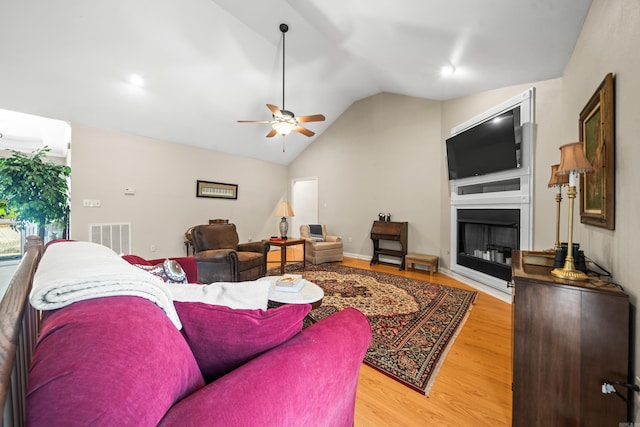 206 Brown, Hot Springs, AR 71913 - living room featuring light wood-style flooring, a ceiling fan, lofted ceiling, and a fireplace