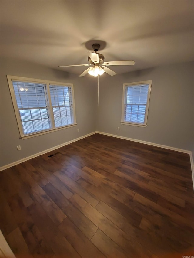 501 W 51st, North Little Rock, AR 72118 - unfurnished room with dark wood-type flooring, baseboards, and ceiling fan
