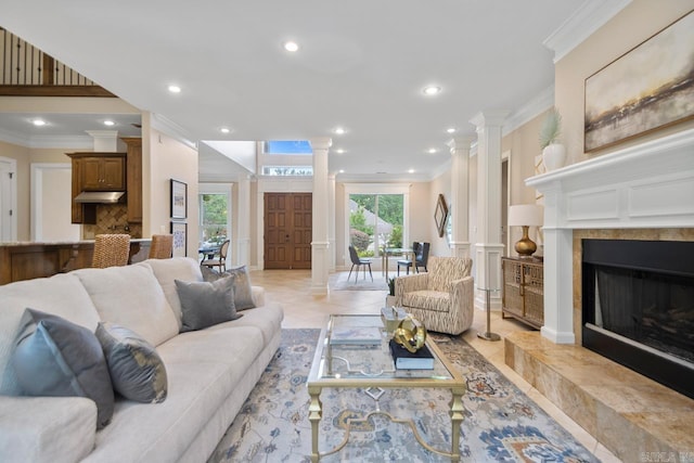 34 Chemin Ct, Little Rock, AR 72223 - living room featuring decorative columns, ornamental molding, recessed lighting, a premium fireplace, and a decorative wall
