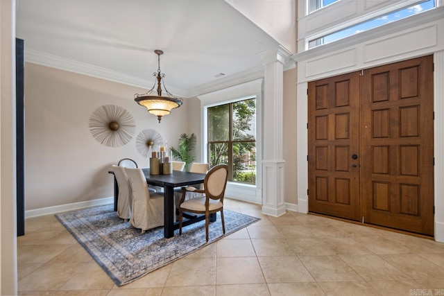 34 Chemin Ct, Little Rock, AR 72223 - dining area with decorative columns, ornamental molding, light tile patterned floors, and baseboards