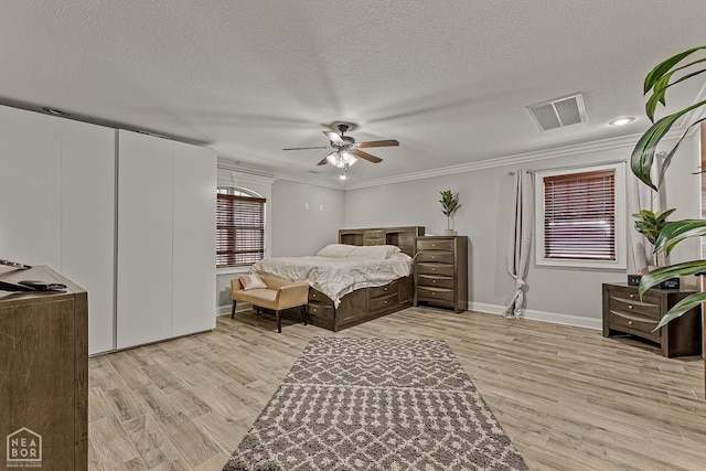 3117 Meador Ave, Jonesboro, AR 72401 - bedroom with light wood-style flooring, ornamental molding, baseboards, a textured ceiling, and ceiling fan