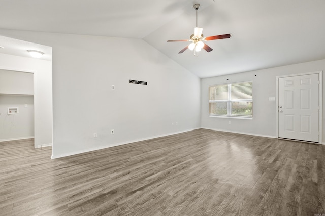 6096 Saddle Hill Dr, Alexander, AR 72002 - unfurnished living room featuring a ceiling fan, lofted ceiling, wood finished floors, and baseboards