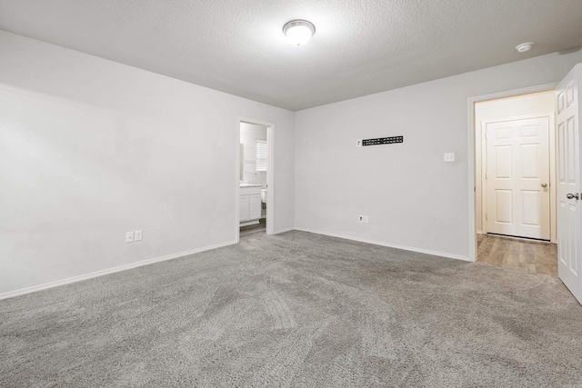 6096 Saddle Hill Dr, Alexander, AR 72002 - carpeted spare room featuring a textured ceiling, baseboards, and a smoke detector