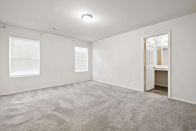 6096 Saddle Hill Dr, Alexander, AR 72002 - carpeted empty room with a textured ceiling and baseboards